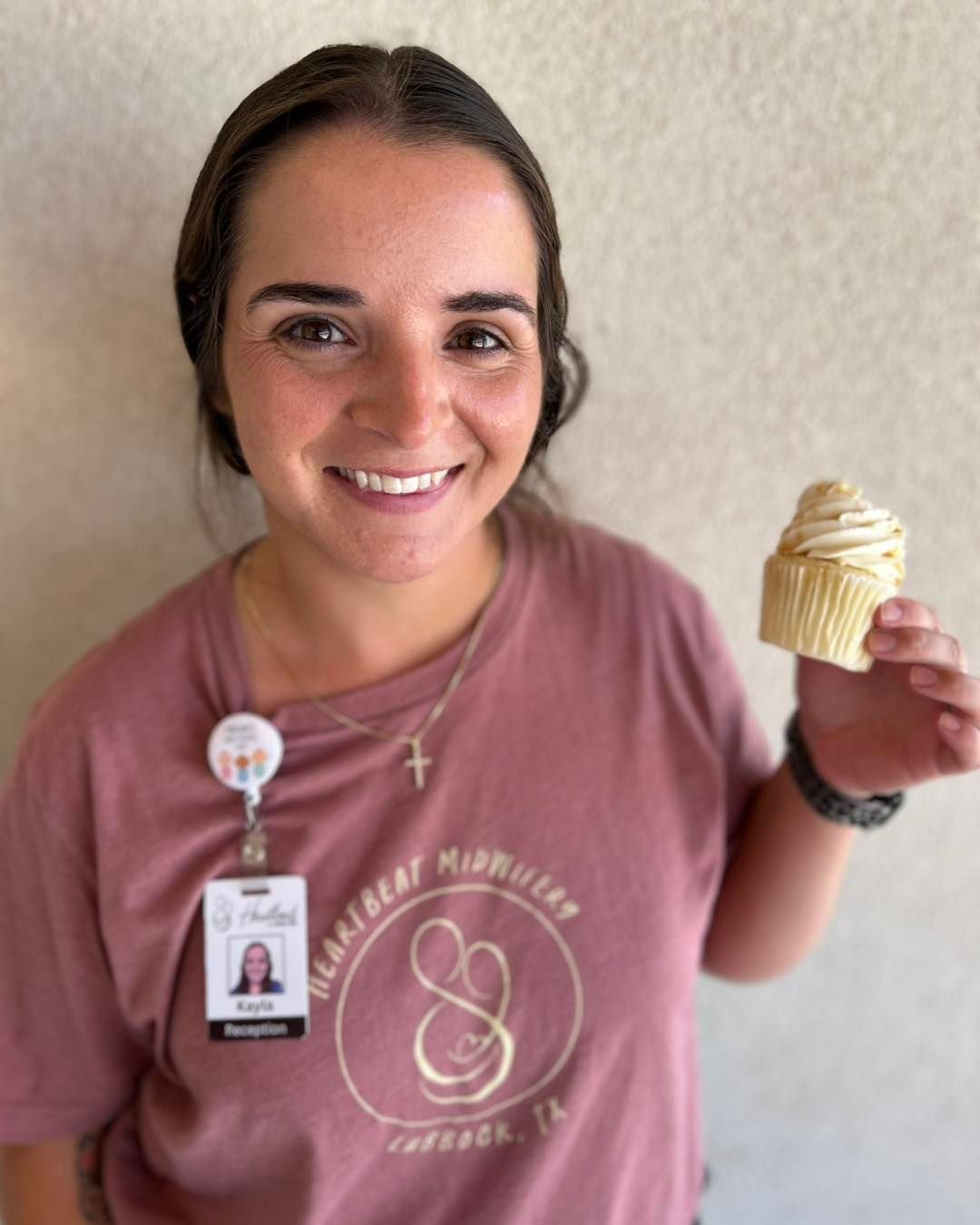 Welcome Kayla - new office team member at Heartbeat Midwifery celebrating with cupcakes